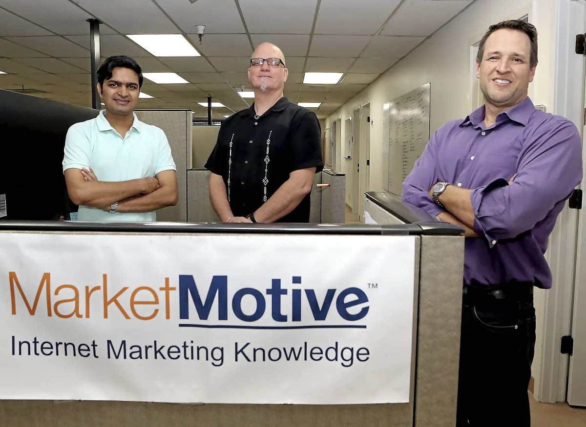 Prashant Parmar, Chip Street, and Michael Stebbins celebrate the merger of Market Motive and Simplilearn. Photo credit: Kevin Johnson - Santa Cruz Sentinel